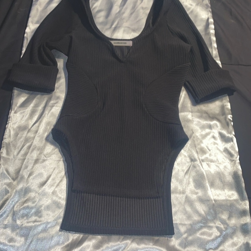 This is a designer shirt by Maniere De Voir US size 4 color black..